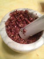 Crushine ingredients with mortar and pestle for Mushroom and Hazelnut Pâté