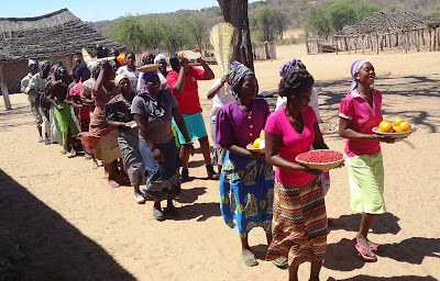 Women from Naucova community welcoming the guests with gifts