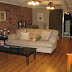 Livingroom With Brick Wall To Kitchen