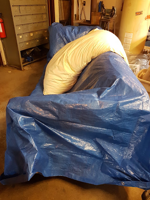 covered couch in garage