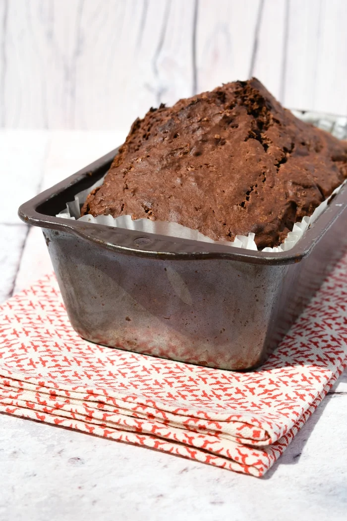 chocolate banana bread with a high rise in a loaf tin