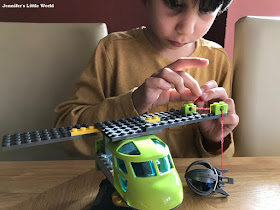 Child taking part in a Lego building challenge