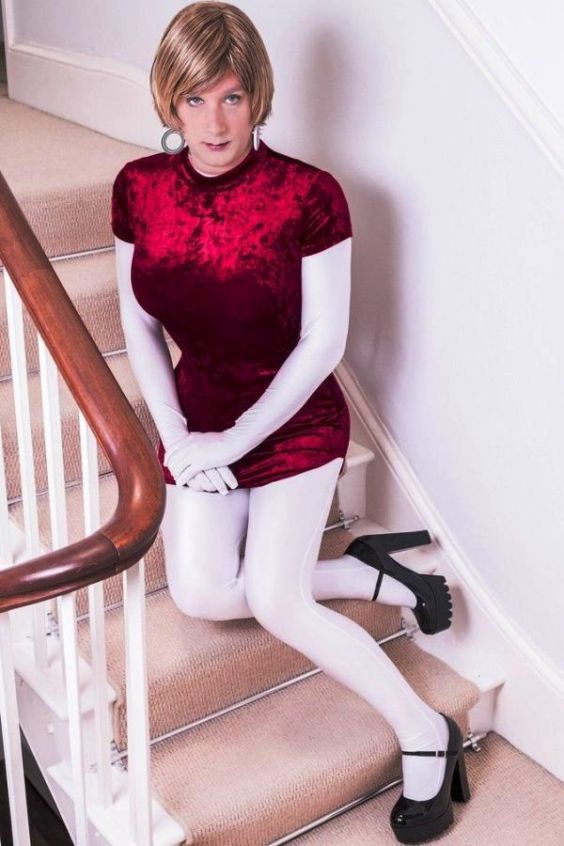 Pretty crossdresser in white bodysuit