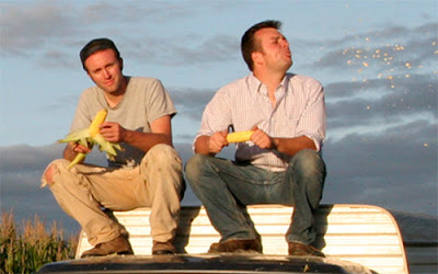 Ian Cheney and Curt Ellis, tasting their corn harvest. Photo by Sam Cullman