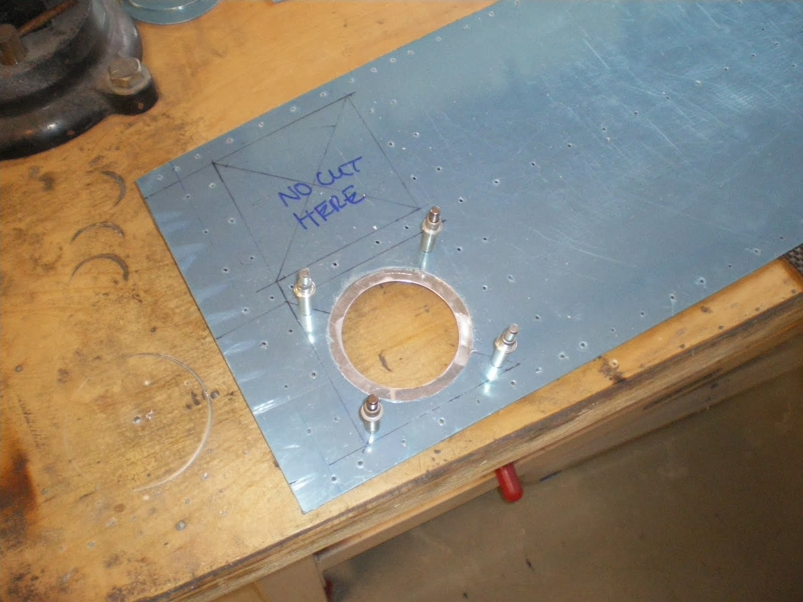 Rear access plate being installed on the tail ski
