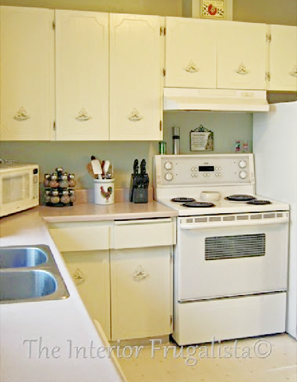 Pretty warm white chalk painted kitchen cabinets.