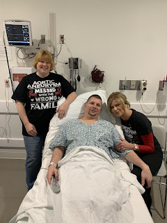 In pre-op and ready to roll.  This family has a tee shirt for every event!