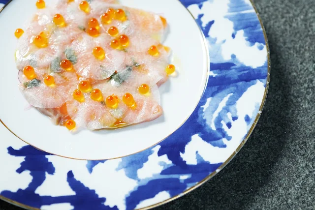 salmon carpaccio with sliced reddish pickles