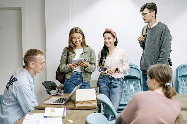 Students, a classroom and programming