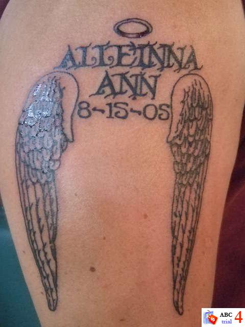 angel holding baby tattoo. tattoos of guardian angels