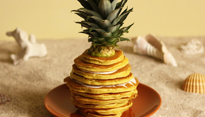 Get ready for summer with this fresh pinapple pancake stack with a light yoghurt  and honey with lemon balm dip. This pineapple shaped pancake stack was brought to you by Pancake Stories.