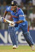 MS Dhoni Bowling Figure. MS Dhoni picture (ms dhoni photos )