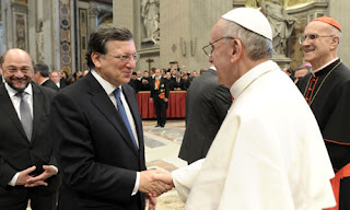 Catholic Pope Francis shakes hands with president of the European Commission