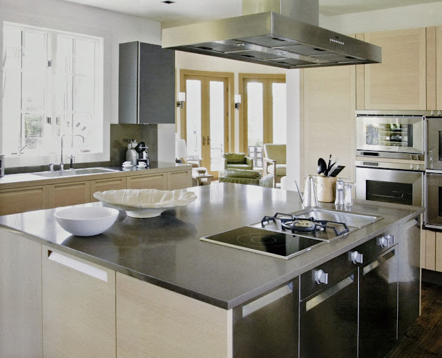 Photo of modern kitchen island in the kitchen of restored cottage