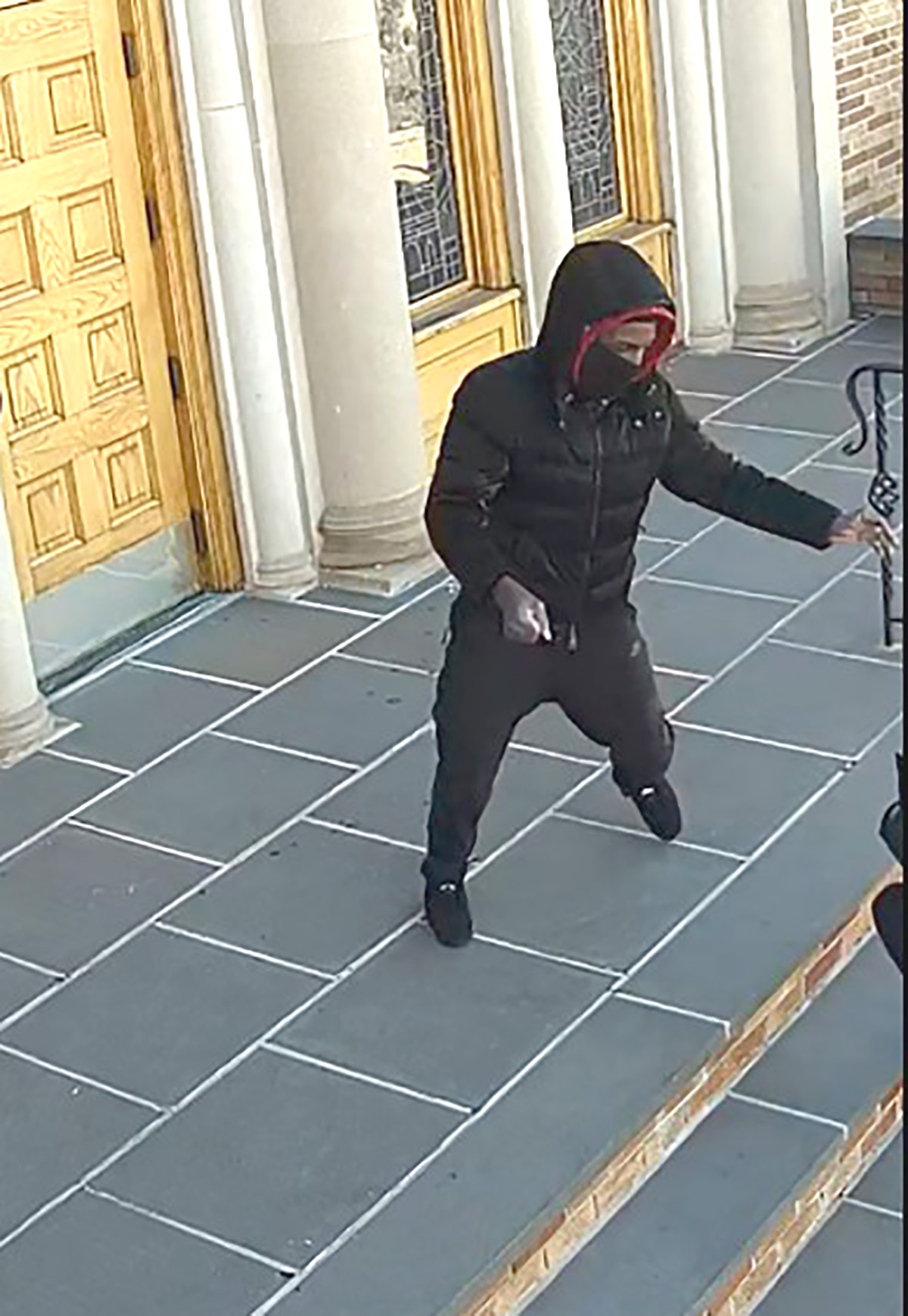 The NYPD arrested a 16-year-old male in connection with an attack on an elderly woman outside a Queens church. -Photo by NYPD