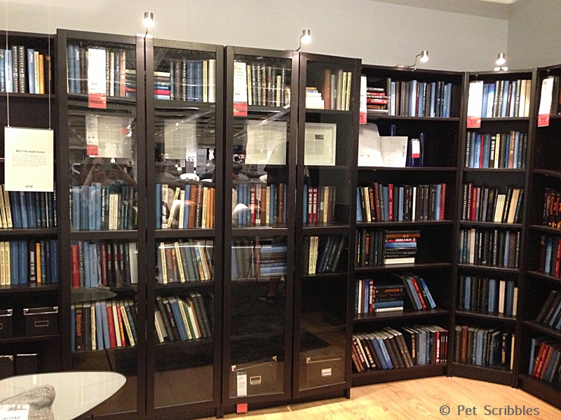  doors; the halogen lamps overhead; and the L-shape of the bookcases