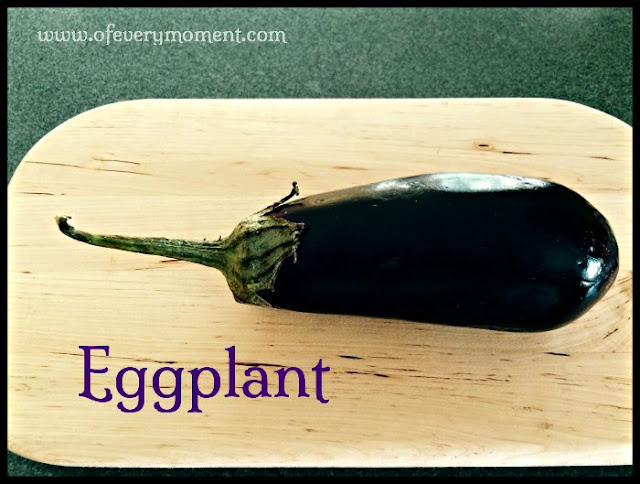 whole eggplant on a cutting board