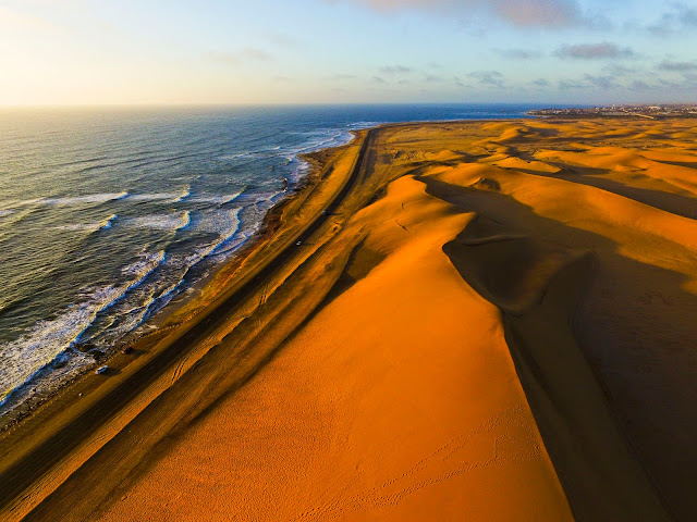 Namibia: Atlantic Coast: sand dunes & ocean aerial photo gallery
