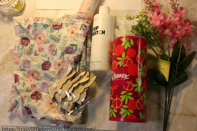 Materials-decorative tissue paper, wooden bunnies, faux floral and tissue tube
