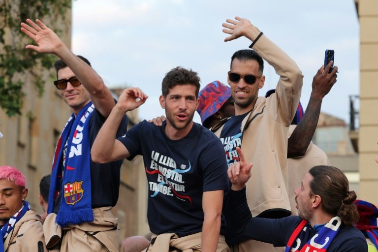 Barcelona men, women celebrate dual league titles with city parade