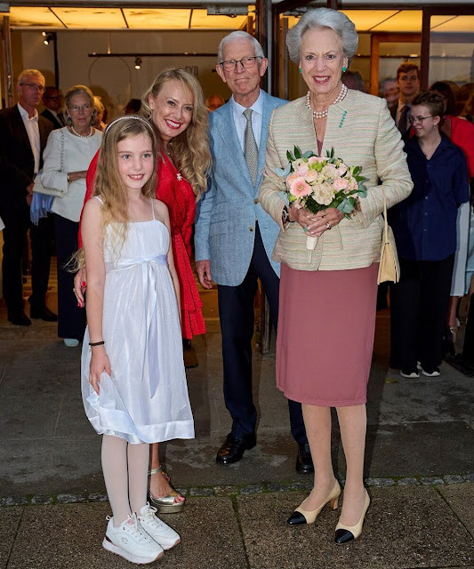 Princess Benedikte wore a beige tweed jacket and dry rose v-neck dress. Chanel pumps. Green earrings and brooch