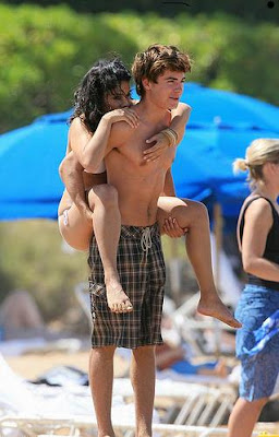 vanessa hudgens riding on back of zac efron