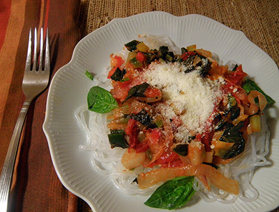 Plate of Pasta with Onion, Green Garlic, dried tomato, and basil