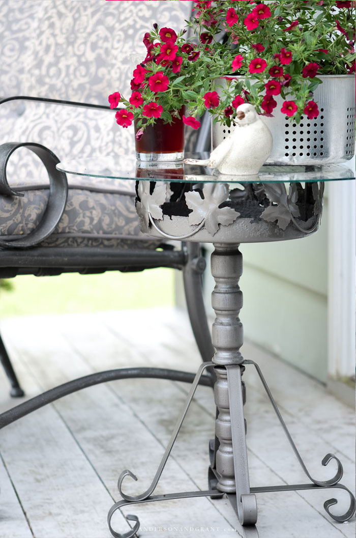 A must see DIY.....this outdoor table is made from a rusty plant stand!  #DIY #repurposed #DIYtable #outdoorprojects