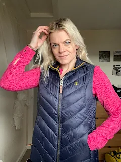 blonde women wearing pink shirt with padded gilet