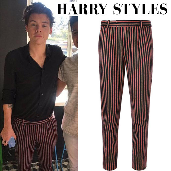 Harry Styles in red striped Gucci trousers