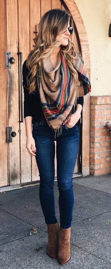 what to wear with a plaid scarf : black top + skinny jeans + boots