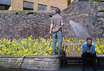 Coincidence photo man being watered