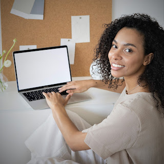 woman typing on her laptop