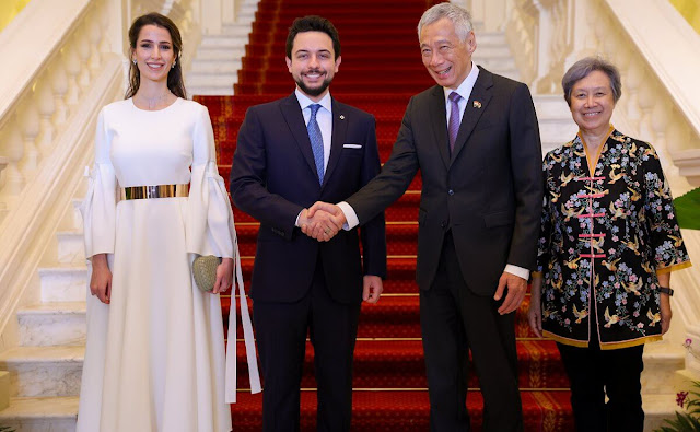 Princess Rajwa wore a white Calmina crepe maxi dress by Roksanda. Prime Minister Lee Hsien Loong and his wife Ho Ching