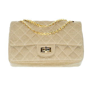 Vintage 1960's tan colored Chanel bag with gold mademoiselle closure and chain strap. 