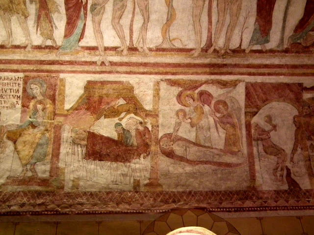 Medieval wall paintings depicting the parable of the rich man and Lazarus in the church of Lignieres en Touraine.  Indre et Loire, France. Photographed by Susan Walter. Tour the Loire Valley with a classic car and a private guide.