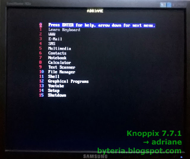 Menu do Knoppix Adriane para deficientes visuais: (0) Ajuda; (1) Aprender Teclado; (2) Internet; (3) Email; (4) SMS; (5) Multimidia; (6) Contactos; (7) Notebook; (8) Calculadora; (9) Reconhecimento de texto; (10) Gerenciador de arquivos; (11) Shell; (12) Programas gráficos; (13) Youtube; (14) Configurações; (15) Desligar.