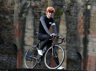 Picture of Emily Bridges with her bicycle