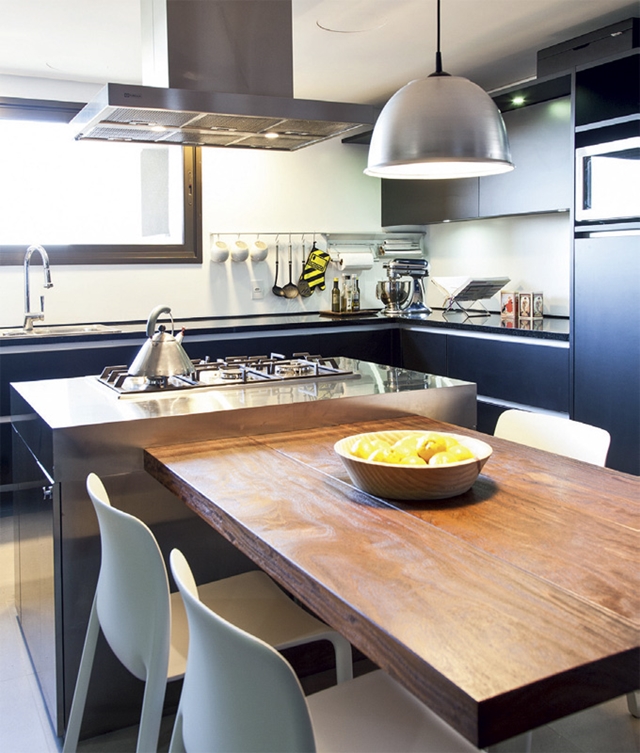 Small kitchen with wooden dining table 