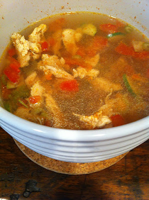 Chicken and vegetable soup with carrot broth