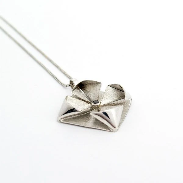 silver metal origami necklace pendant on silver chain