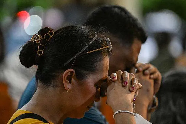 People pray during Mass at Baclaran Church in Parañaque, Metro Manila, on April 21, 2025, following the death of Pope Francis in the Vatican. Photo by Jam Sta Rosa/AFP