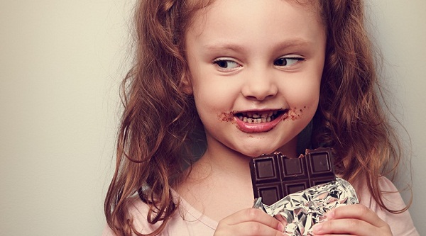 Cute Baby Girl Eating Chocolate