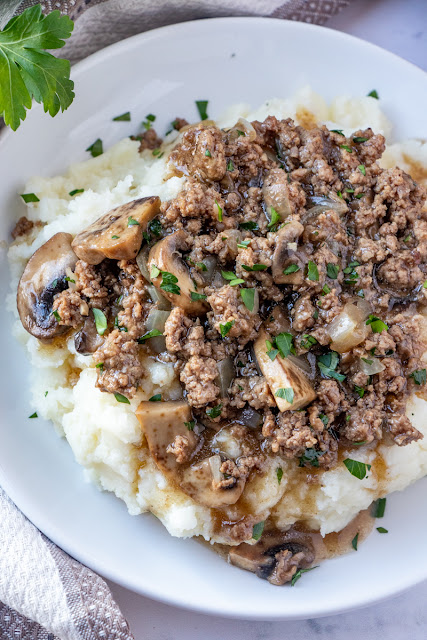 This meat and potatoes comfort food just like grandma used to make is the perfect easy dinner idea! Ready in less than 30 minutes and great served over mashed potatoes, baked potatoes, cooked rice or egg noodles! The mushrooms, onion and garlic add so much delicious flavor!