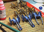 Spanish guns in natural wood and American guns in bluegray.