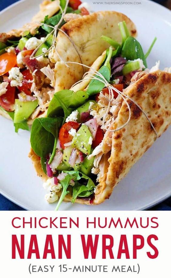 Need a healthy & easy meal you can prep for the week ahead? Or a quick 15 minute meal for lunch or dinner? Fix these yummy Chicken Hummus Naan Wraps! They're filled with shredded rotisserie chicken, lettuce, hummus, sliced veggies, crumbled cheese & a delicious vinaigrette that will keep your belly happy with little work. #chickenrecipes #mealprep #lunch #healthyrecipes #quick #realfood #dinnerrecipes