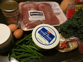 Ingredients for a home-cooked dog diet laid out on the counter.