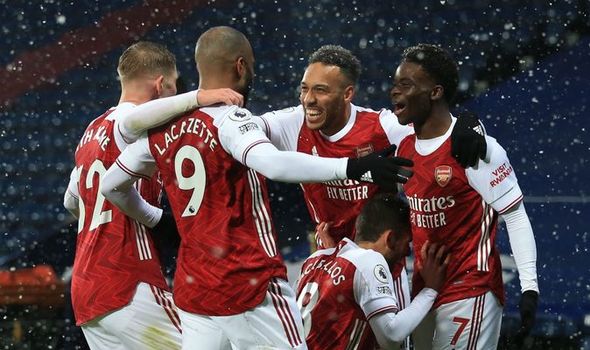 Arsenal players celebrate with Lacazette