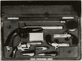Cased gunmaker's display set is in white, unfinished, ready for finishing to customer's order. Set includes Flobert pistol of 1845 and Lefaucheux pinfire of type identical to those sold by Marcellus Hartley during Civil War in New York store. Set typifies contemporaneous dating of Floberts, pinfires, and regular percussion pistols in period of rapid evolution from which emerged perfected U.S. cartridge designs of Smith and B. Tyler Henry. Case shown from Sig Shore, Chicago, collection