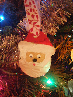 santa salt dough christmas ornament hung on christmas tree